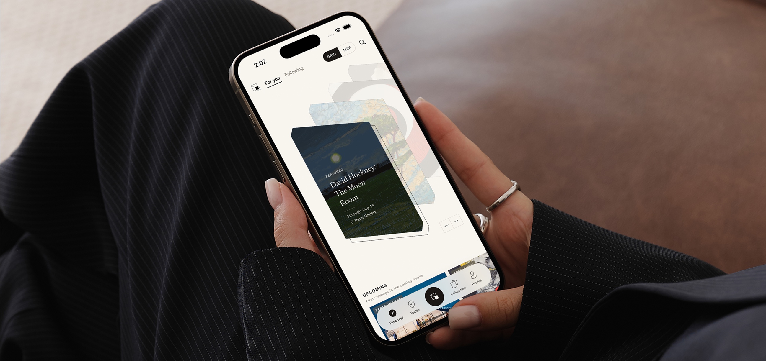Praxima Compass running on an iPhone held in one hand
